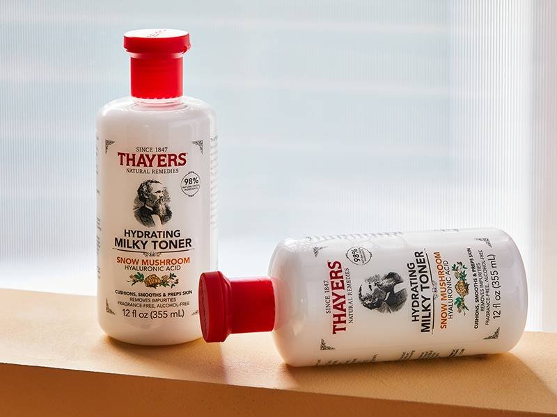 Two bottles of Thayers Milky Hydrating Face Toner on a table
